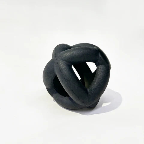 Close up of Black K9 Ultra-Durable Dog Ring Ball. Indestructible dog toy made from tough rubber. Perfect for aggressive chewers and high-energy play, ensuring safety and fun.