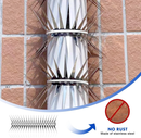 Two stainless steel spike strips wrapped around a vertical white pipe against a tiled wall.