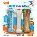 Nylabone Puppy Triple Pack, featuring chew toys and treats for healthy chewing habits & dental hygiene.
